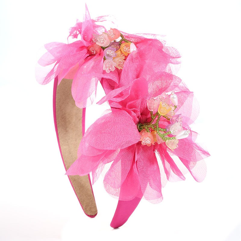 Pink floral headband showing playful occasion styling