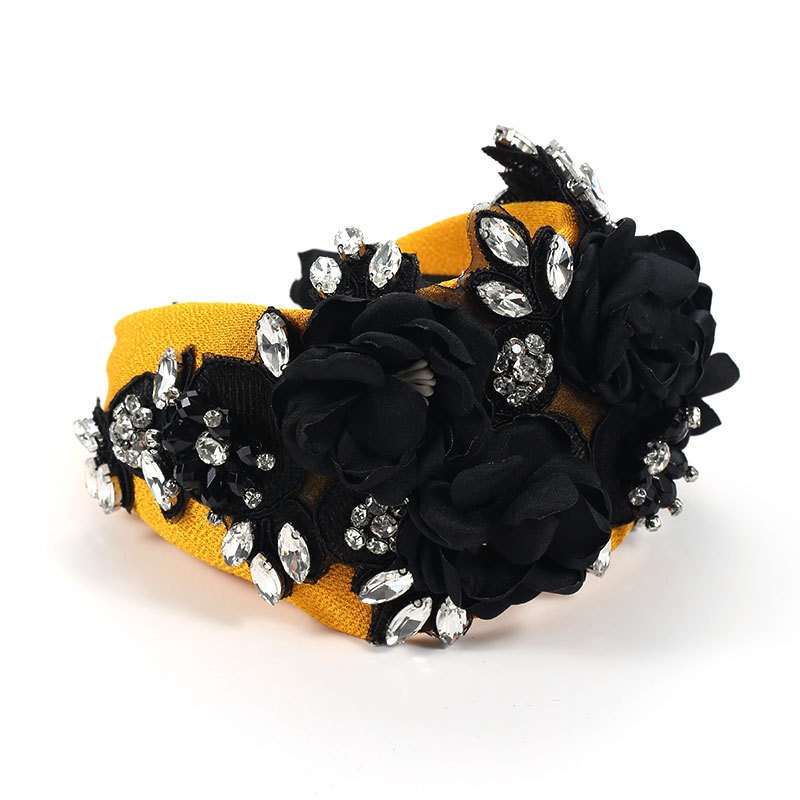 Black gold headband with rhinestones and silver-tone leaves