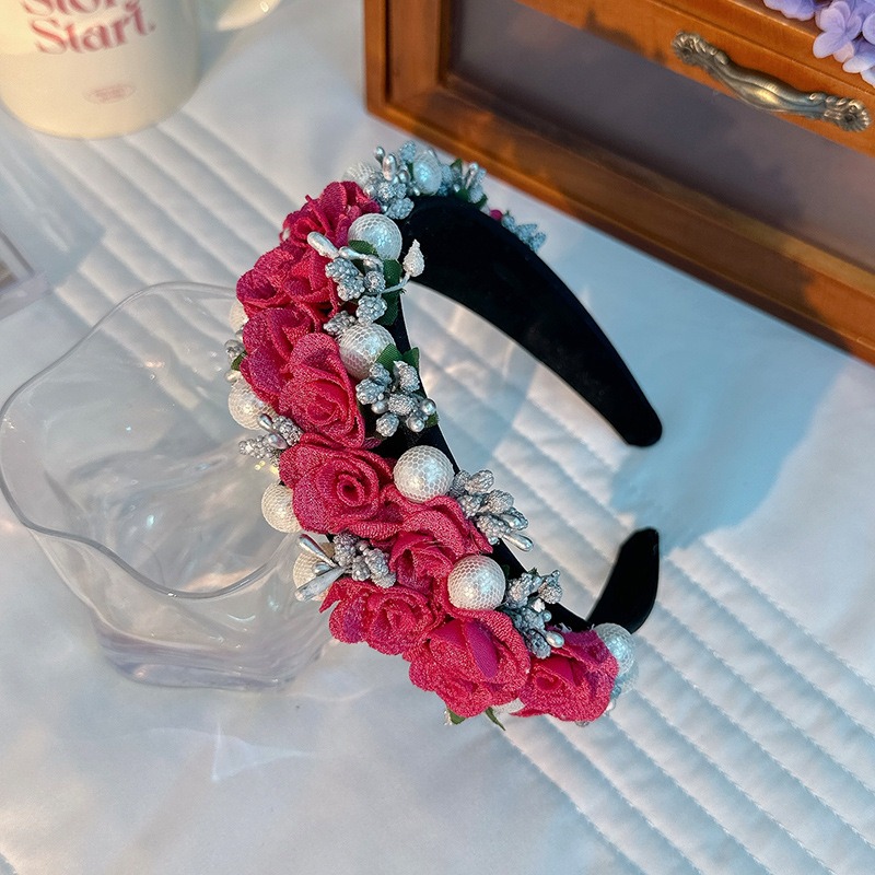 Close view of textured roses and pearl-like floral embellishments