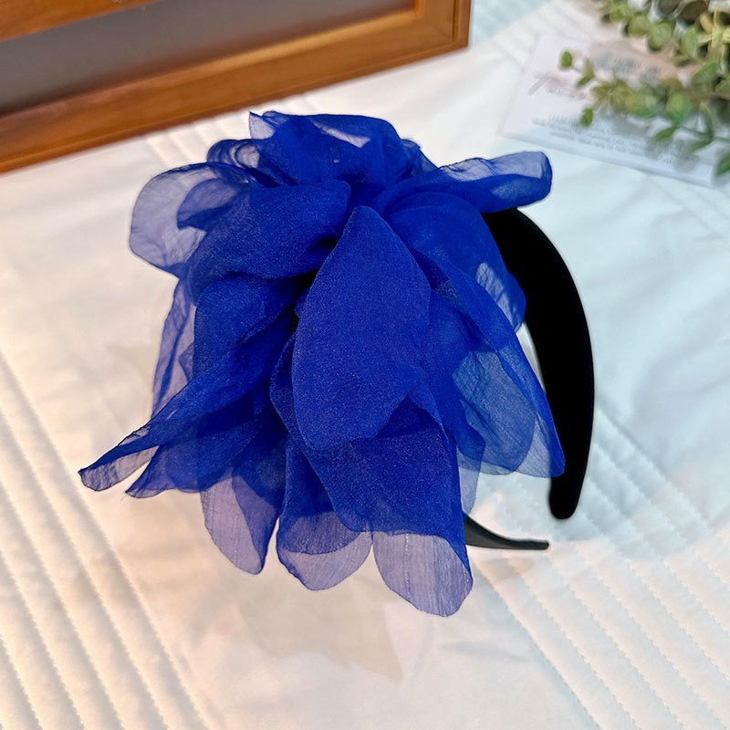 Cobalt blue headband showing layered translucent petals