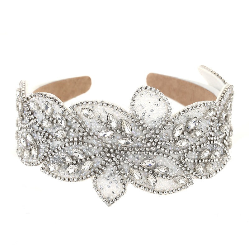Silver padded headband showing scalloped structured edges