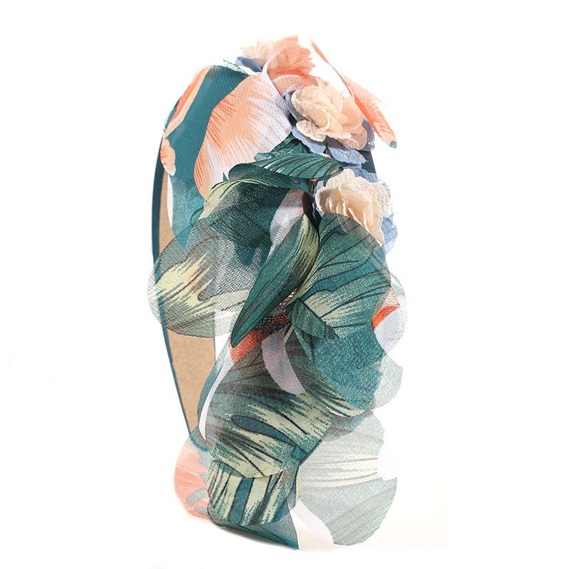 Teal botanical headband with flowing printed fabric panels