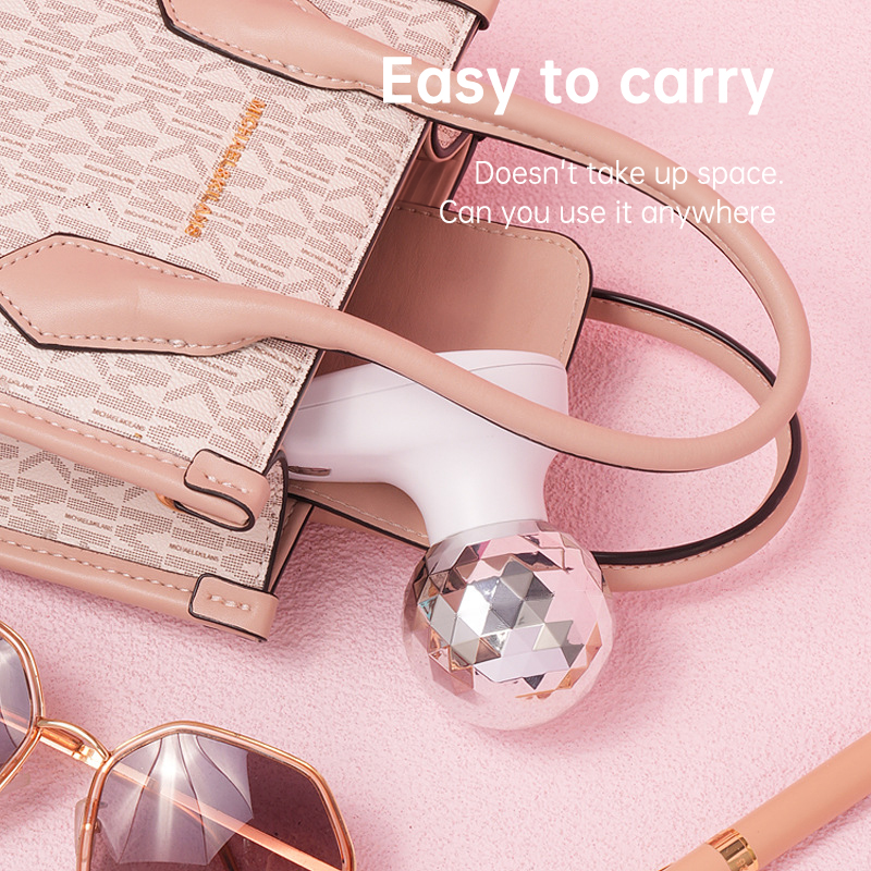 Fascia gun packed in a pink handbag with accessories, showing minimal footprint and travel readiness