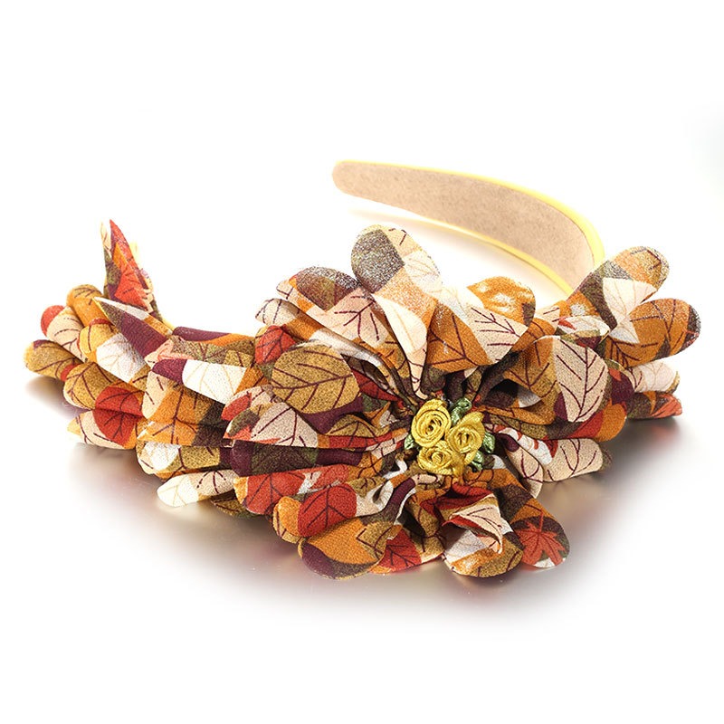 Rust mustard fabric petals and botanical leaves