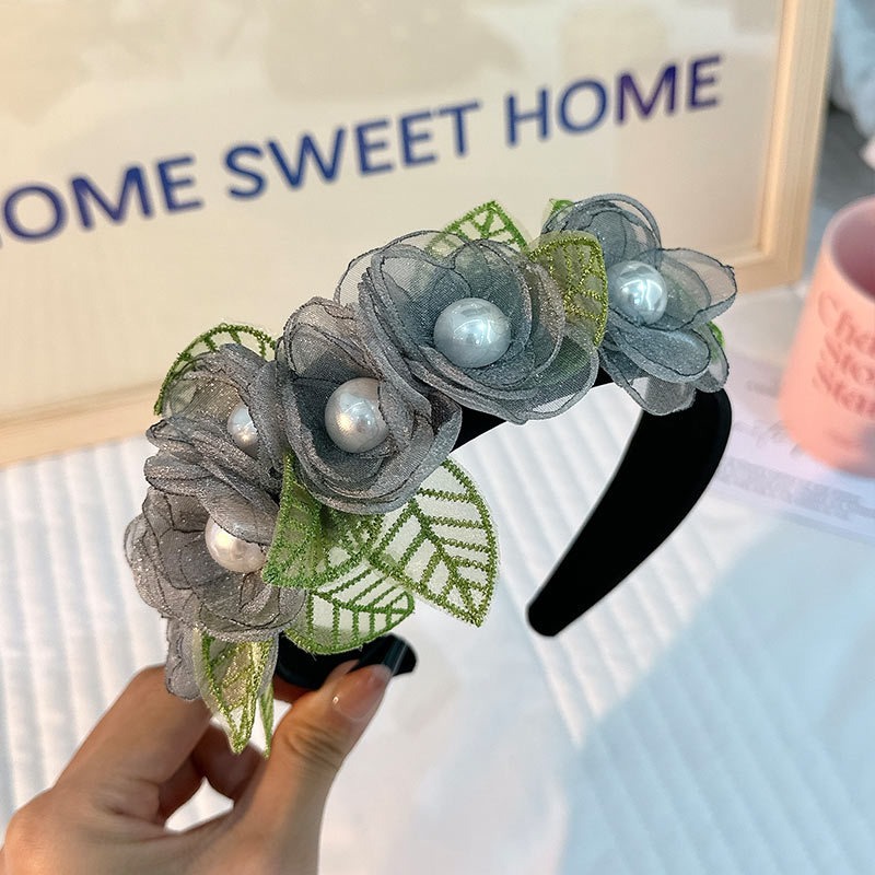 Floral headband with embroidered mesh leaves and black band