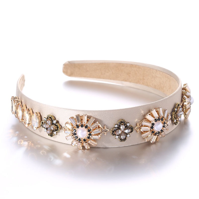 Ivory headband showing structured arch and floral silhouette