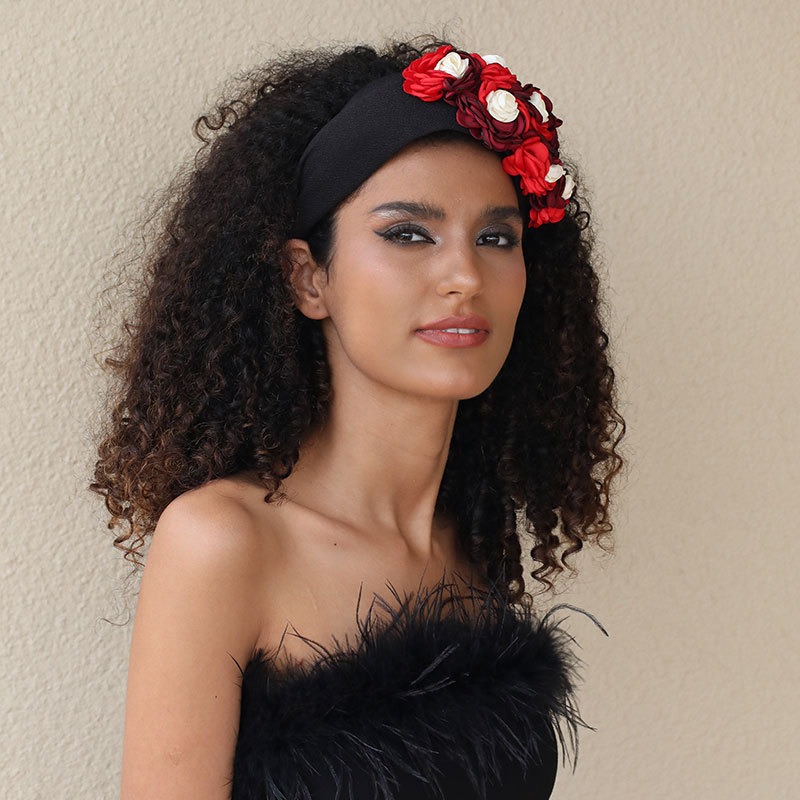 Wide fabric-covered floral headband worn by model