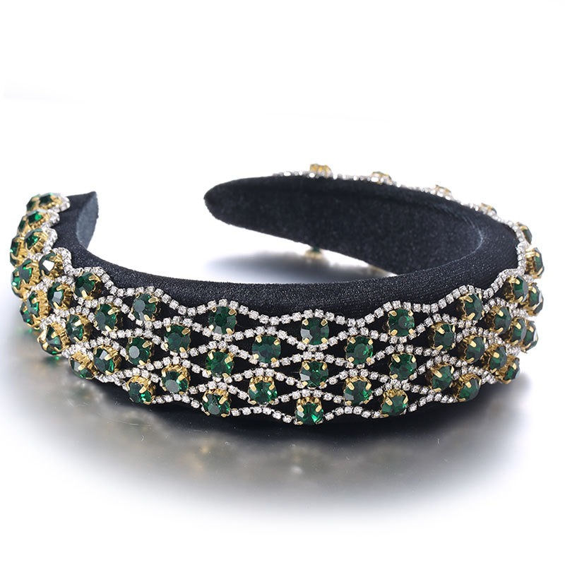 Emerald green padded hoop with intricate jeweled inlay