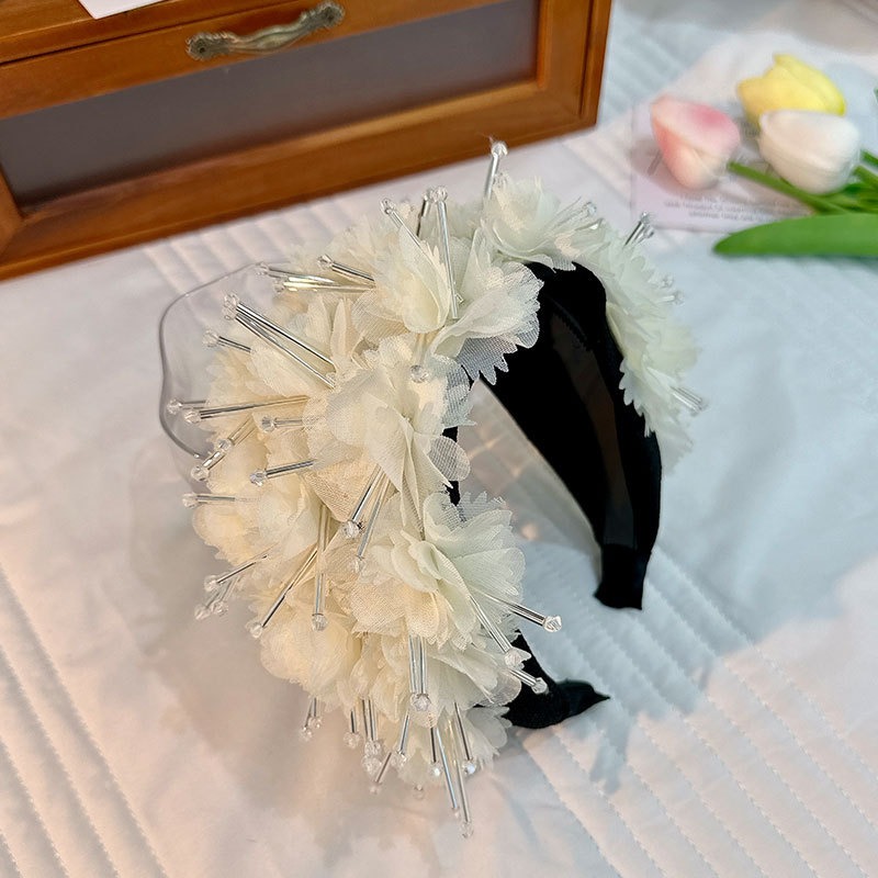Ivory padded wide band in romantic setting