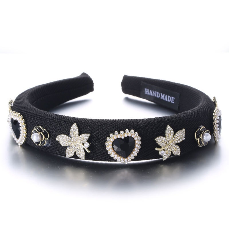 Black padded fabric hoop with raised decorations