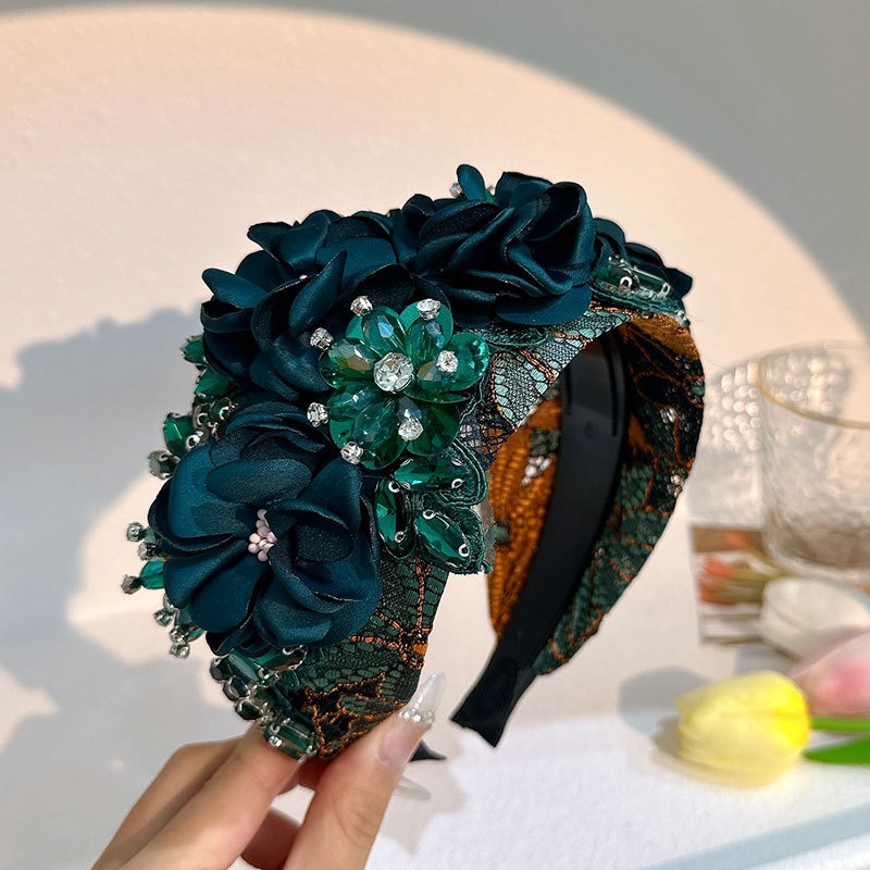 Teal black headband showing wide padded structure