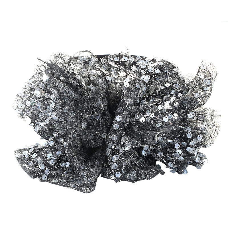 Black silver bow showing sheer layered fabric