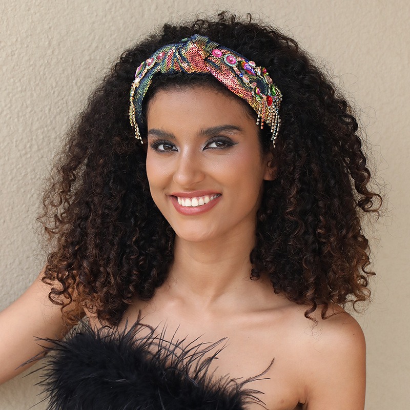 Woman wearing colorful headband framing her face
