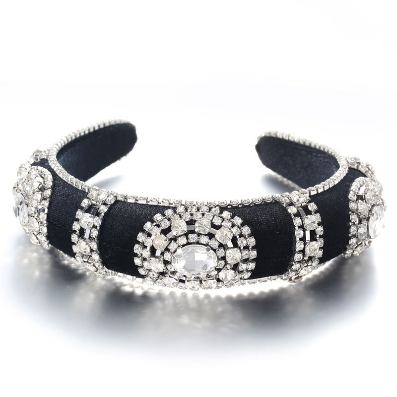 Silver rhinestone hoop catching light across faceted stones