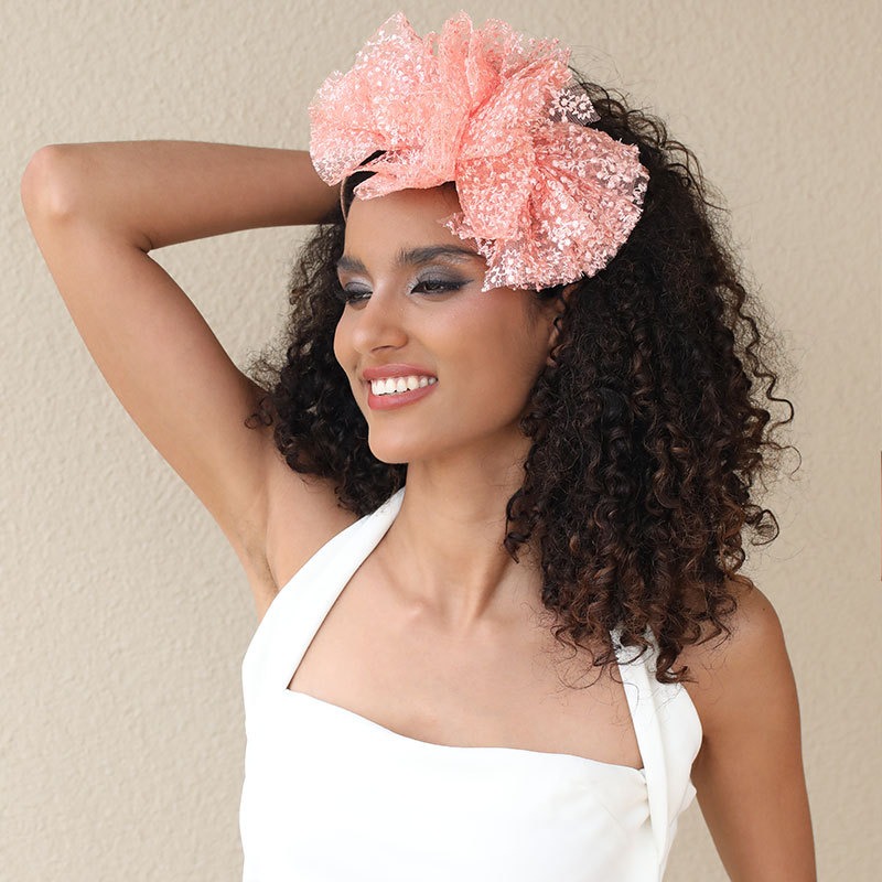 Pink lace bow headband styled with white outfit