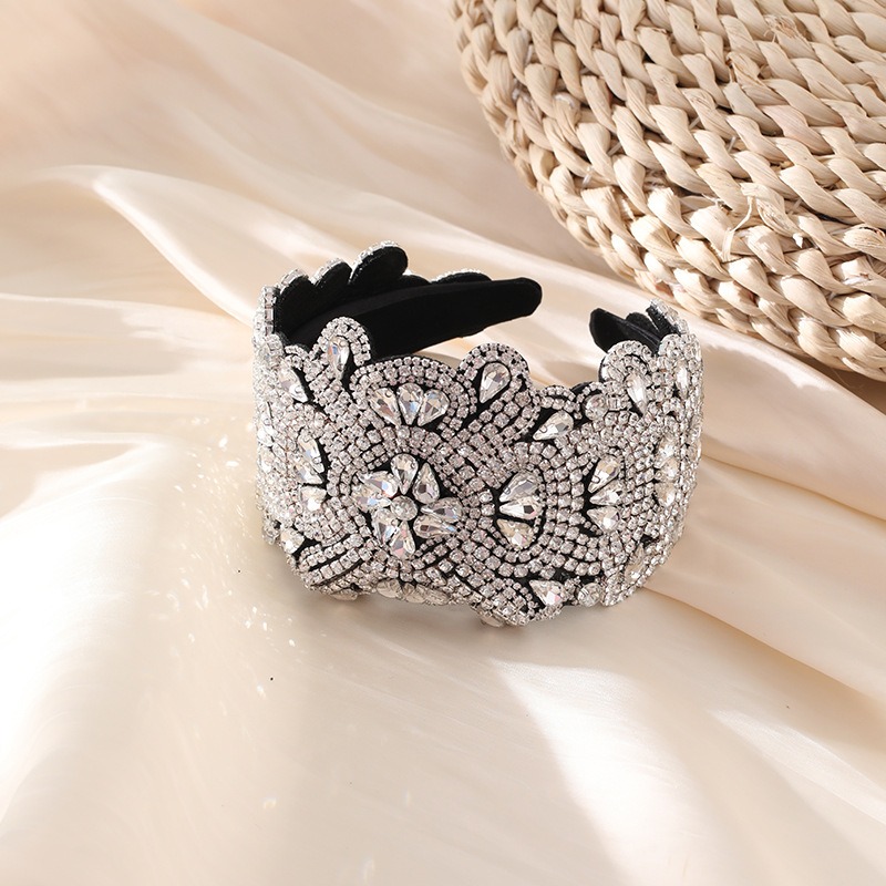Silver crystal surface with ornate symmetrical embellishment