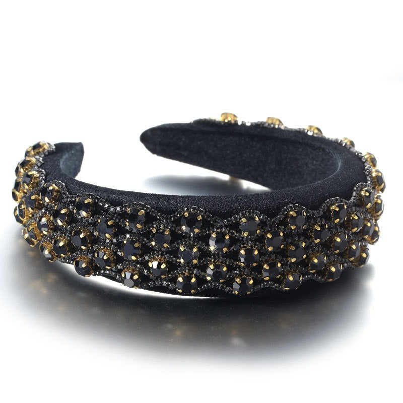 Black headband covered in layered dark crystals