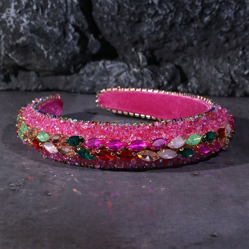 Hot pink headband covered in colorful rhinestones
