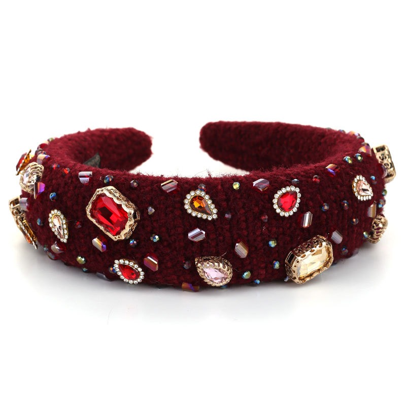 Macro view of hand-sewn crystals and faceted jewel accents