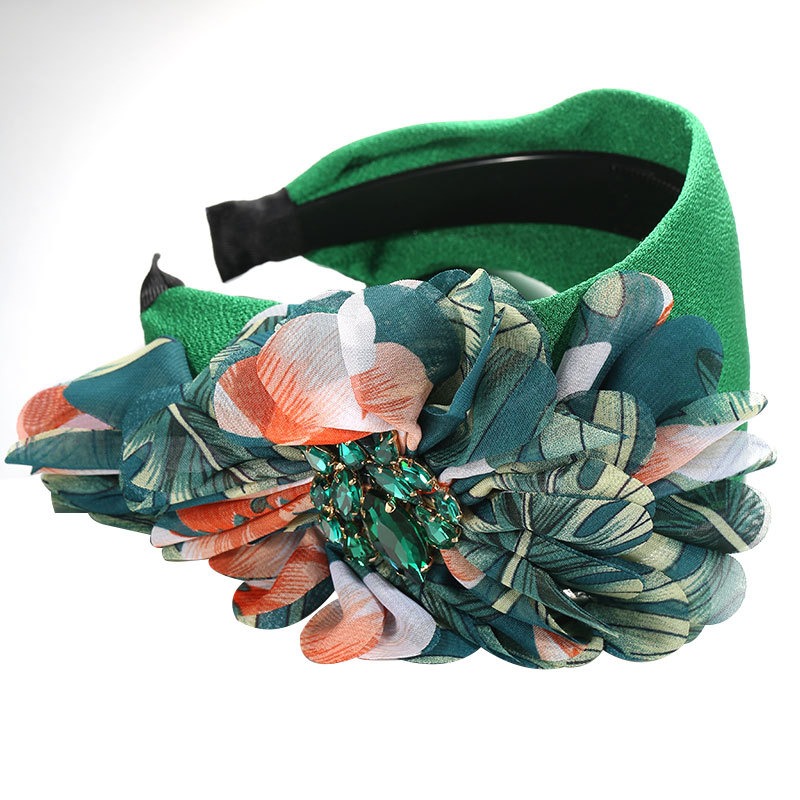 Green floral headband showing fabric-covered band