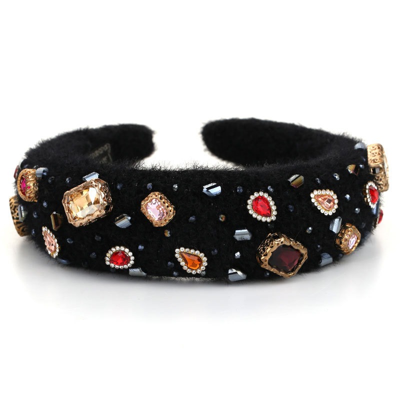 Black crystal hoop styled with contrasting jewel tones