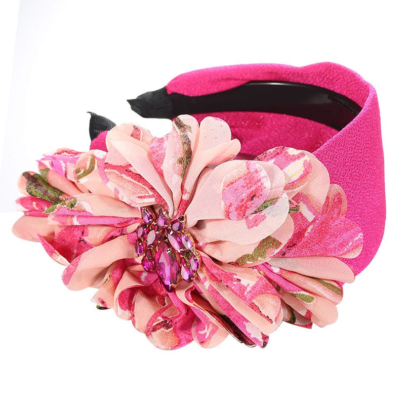 Pink fabric flower with sparkling faceted centerpiece