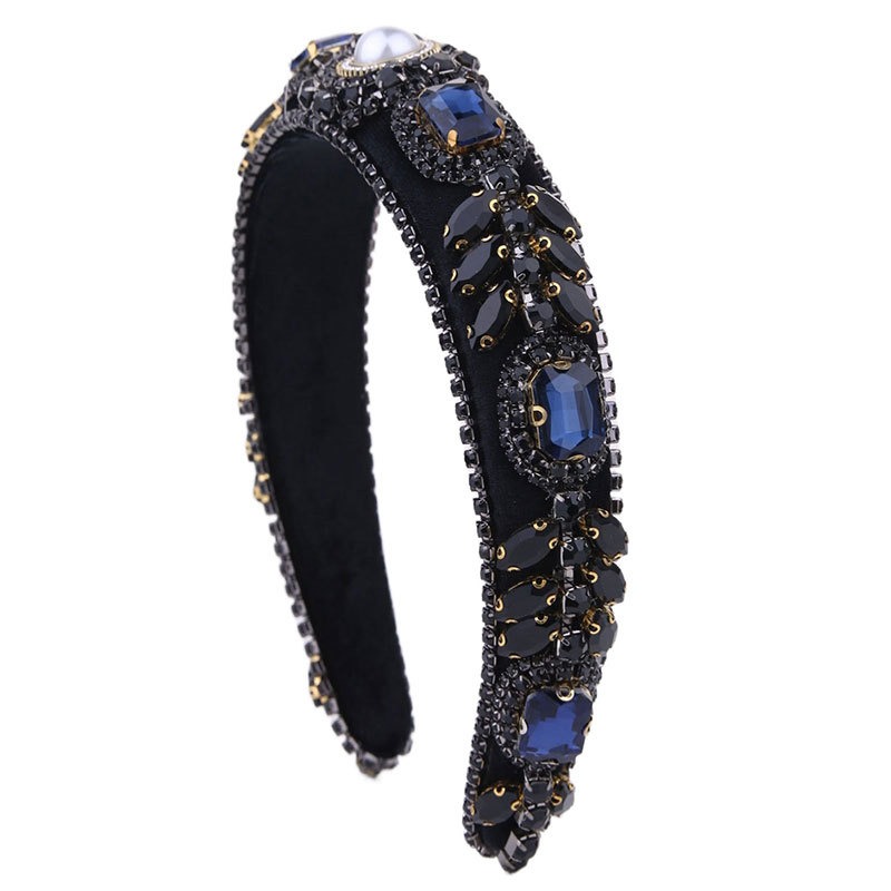 Padded arched headband with blue and gold embellishments