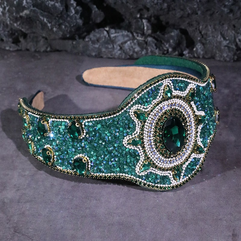 Green jeweled hoop with padded inner band visible