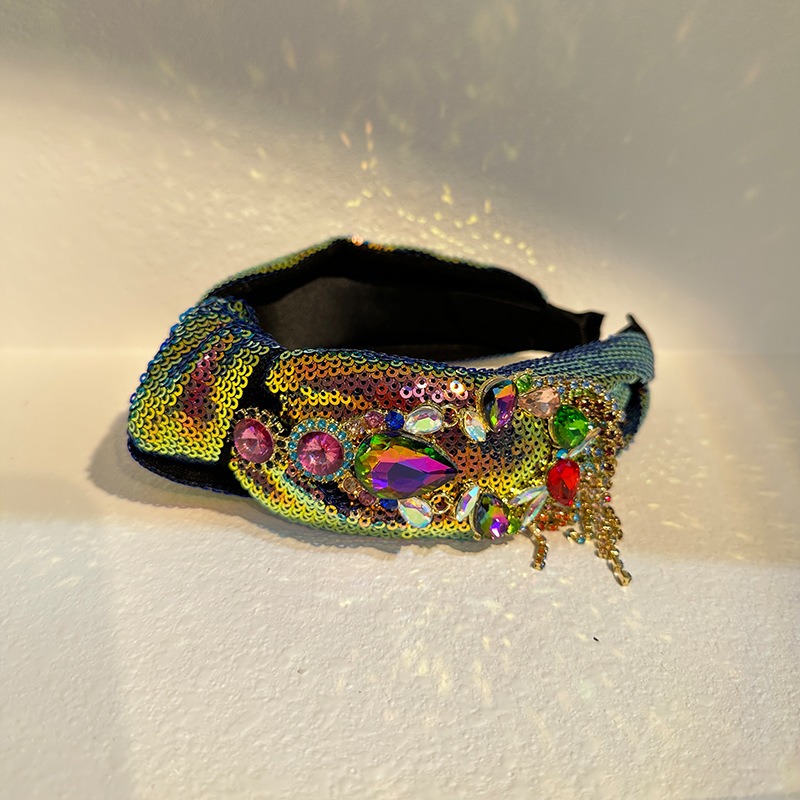Side profile showing dangling bead and chain accents