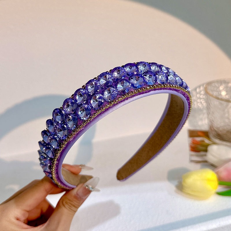 Dense purple rhinestone rows with geometric circular details