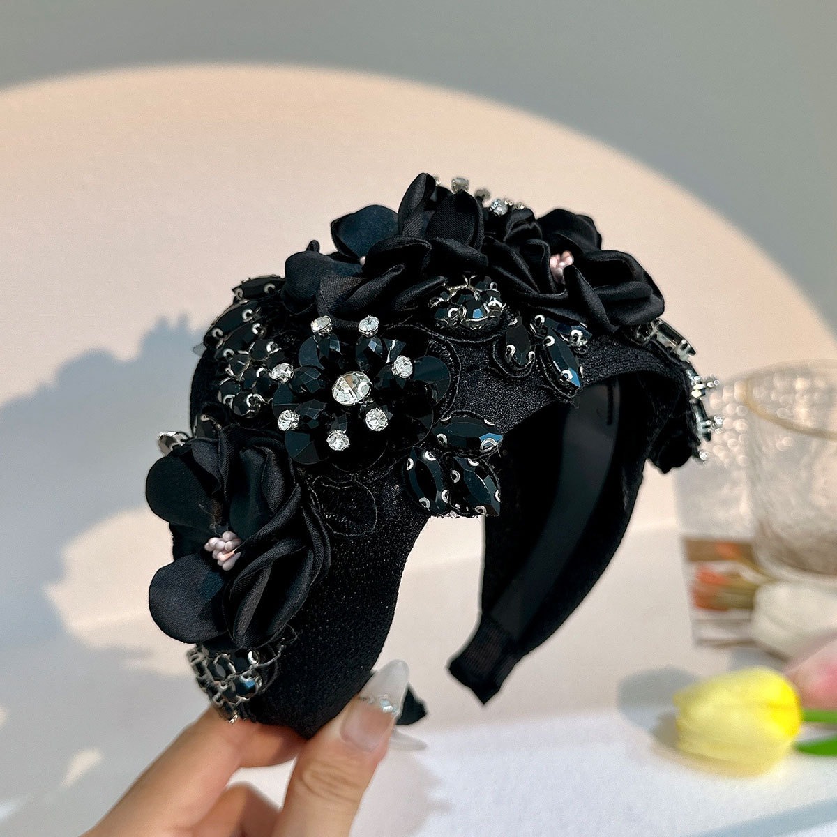Black headband showing flowers sequins beads crystals