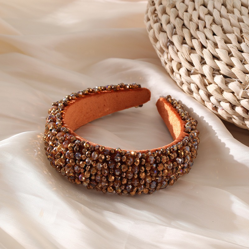 Bronze beaded headband styled beside satin