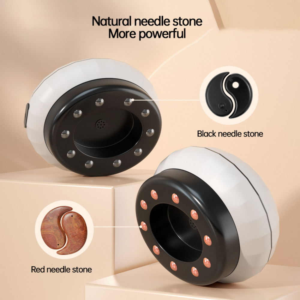 Close‑up detail of interchangeable black and red needle stones with yin‑yang pattern and LED heating array