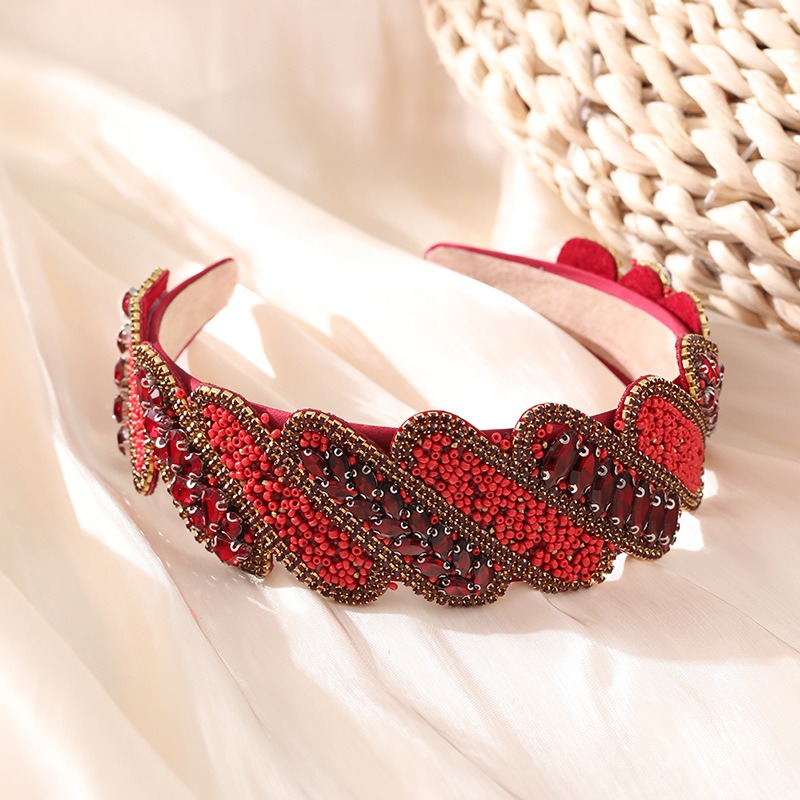 Structured red baroque headband with padded inner band