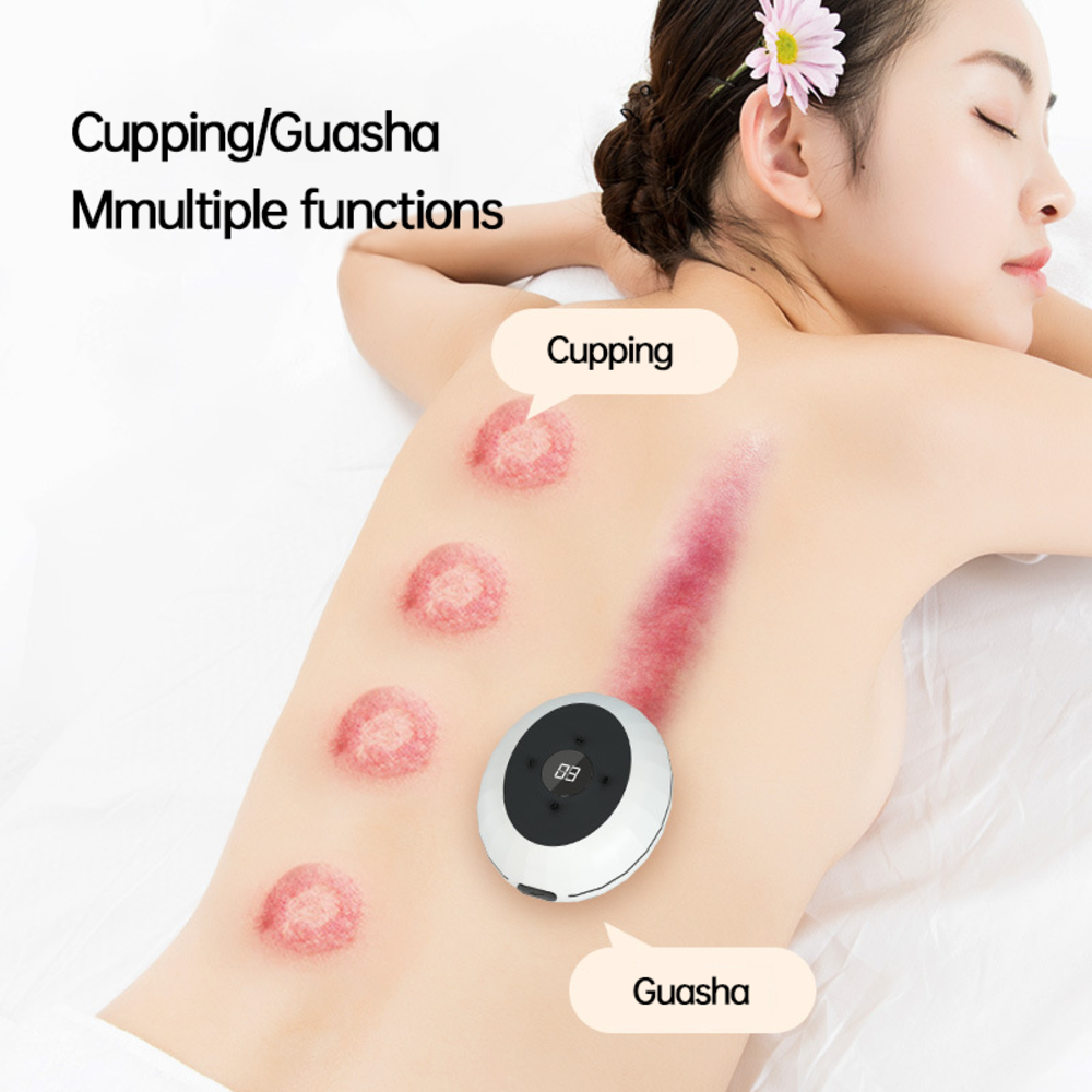 Woman receiving cupping and guasha treatment on back, showing visible circular red marks and device with digital display