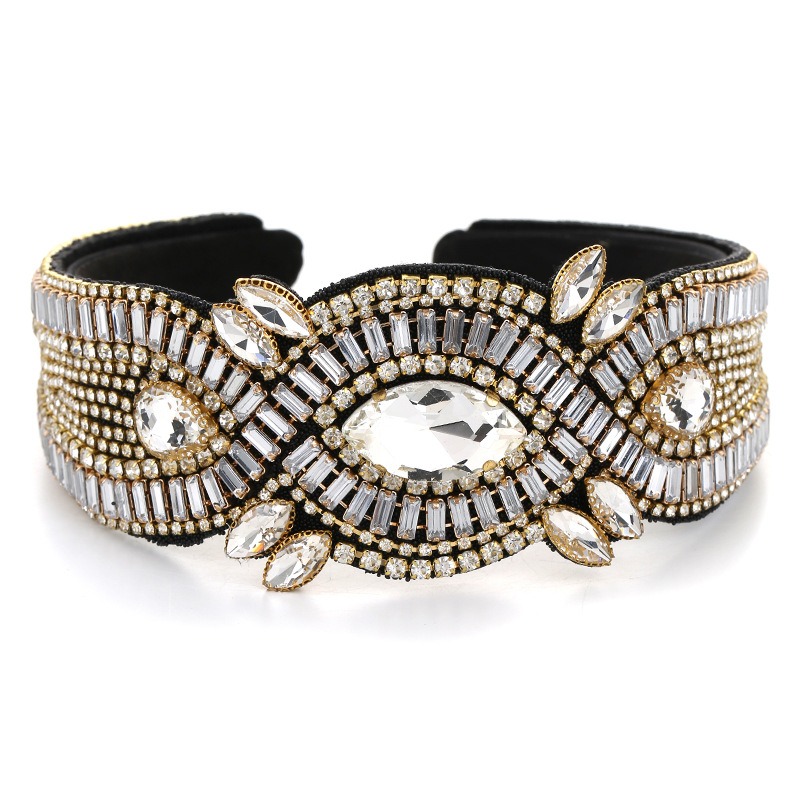 Close view of faceted stones and gold-tone settings