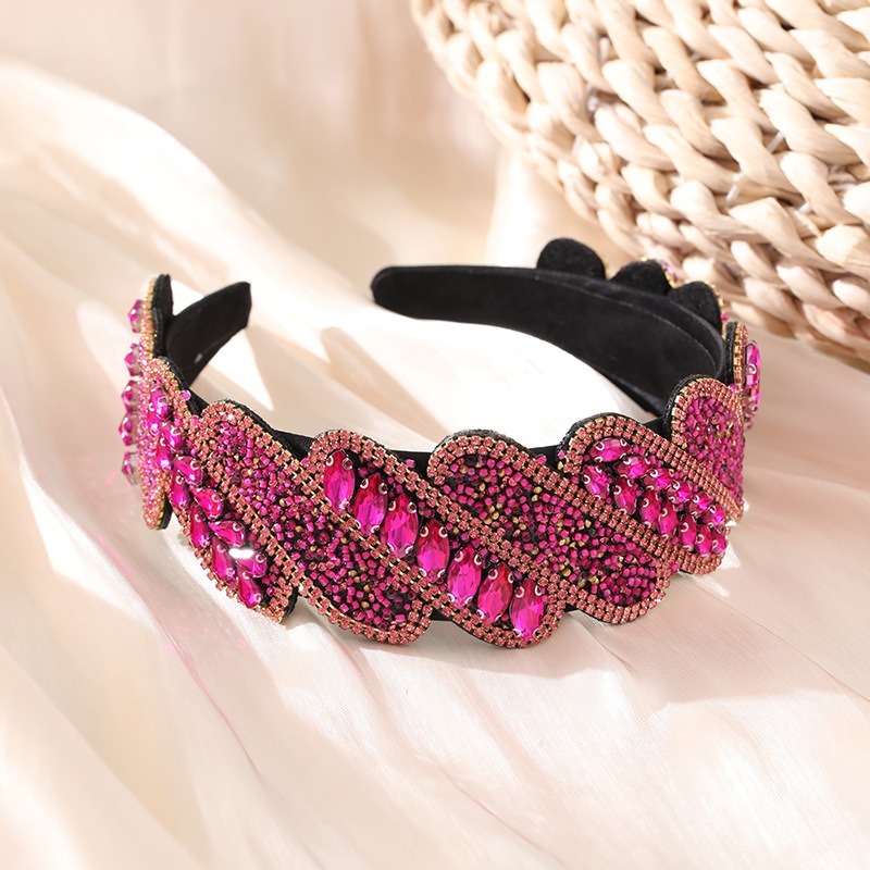 Fuchsia embellished headband styled on cream fabric