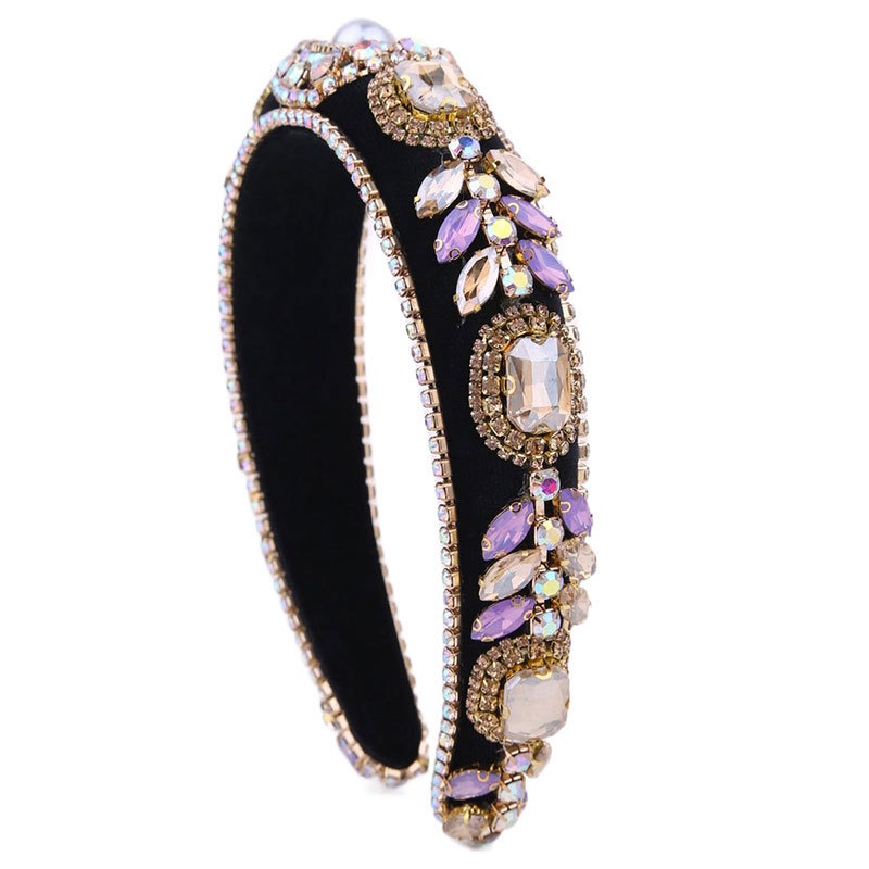 Faceted lavender stones surrounded by rhinestone edging
