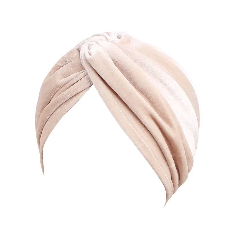 Blush beige turban showing defined sculpted twist