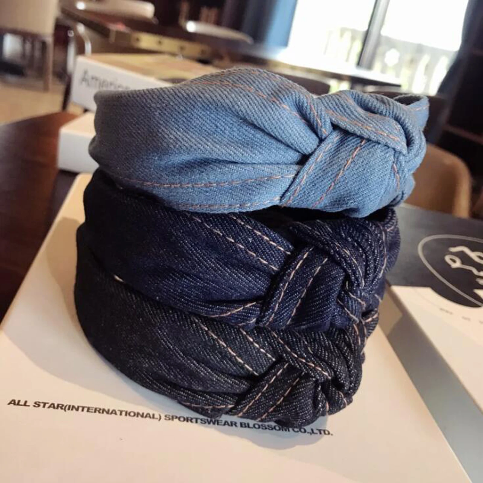 Layered denim center knot with contrasting tan seams