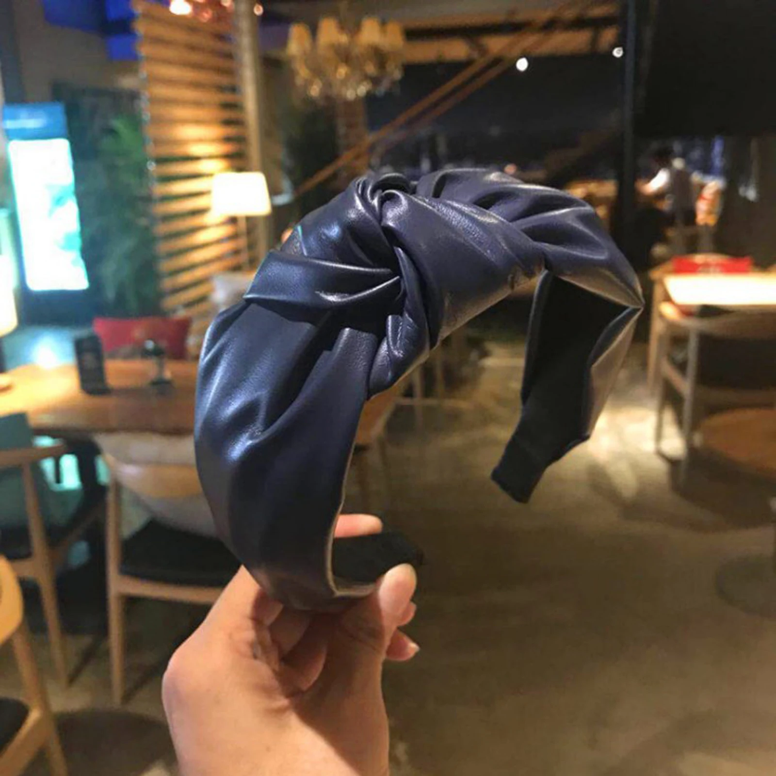 Navy blue wide padded headband from front angle