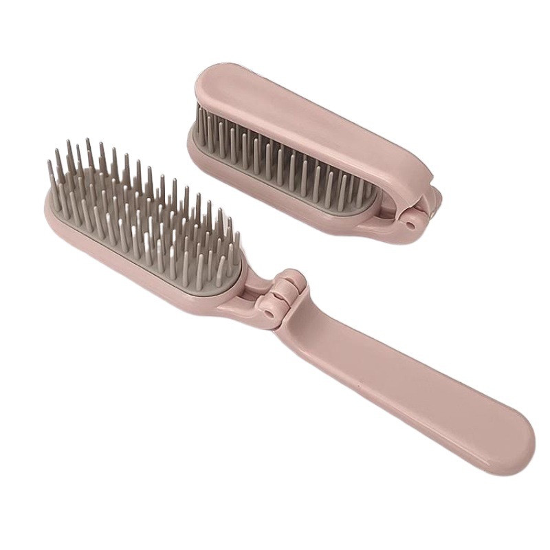 Closed protective cover beside pink comb fine teeth