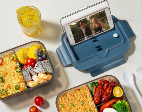 Japanese style microwaveable lunch box with compartments and cutlery
