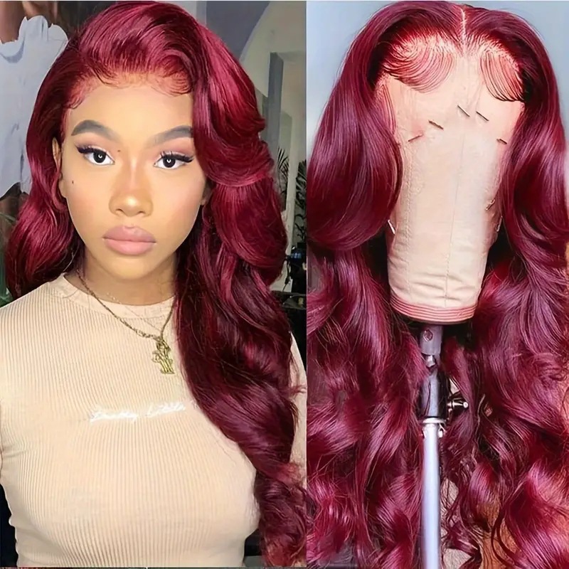 Model showing long loose burgundy waves and curls