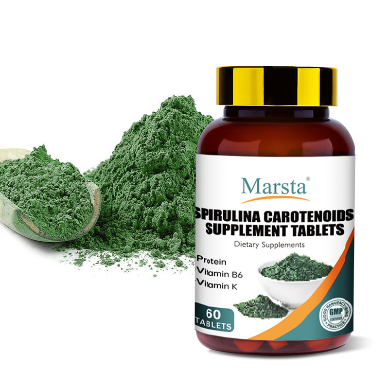 Marsta Spirulina Carotenoids bottle on pale apricot suede with soft sunrise light