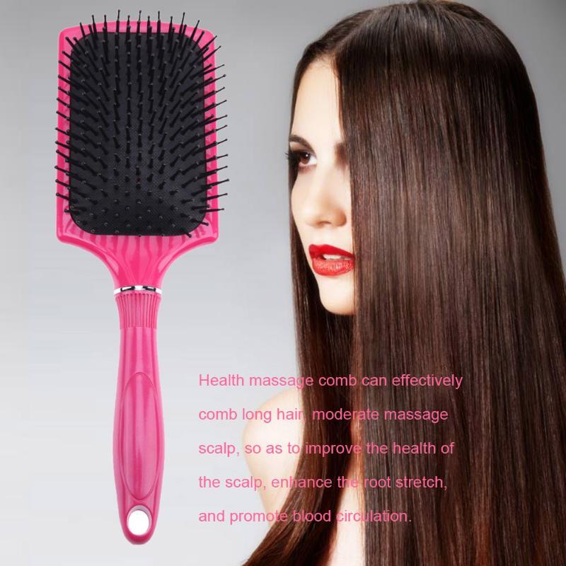 Pink paddle brush in a long hair care routine