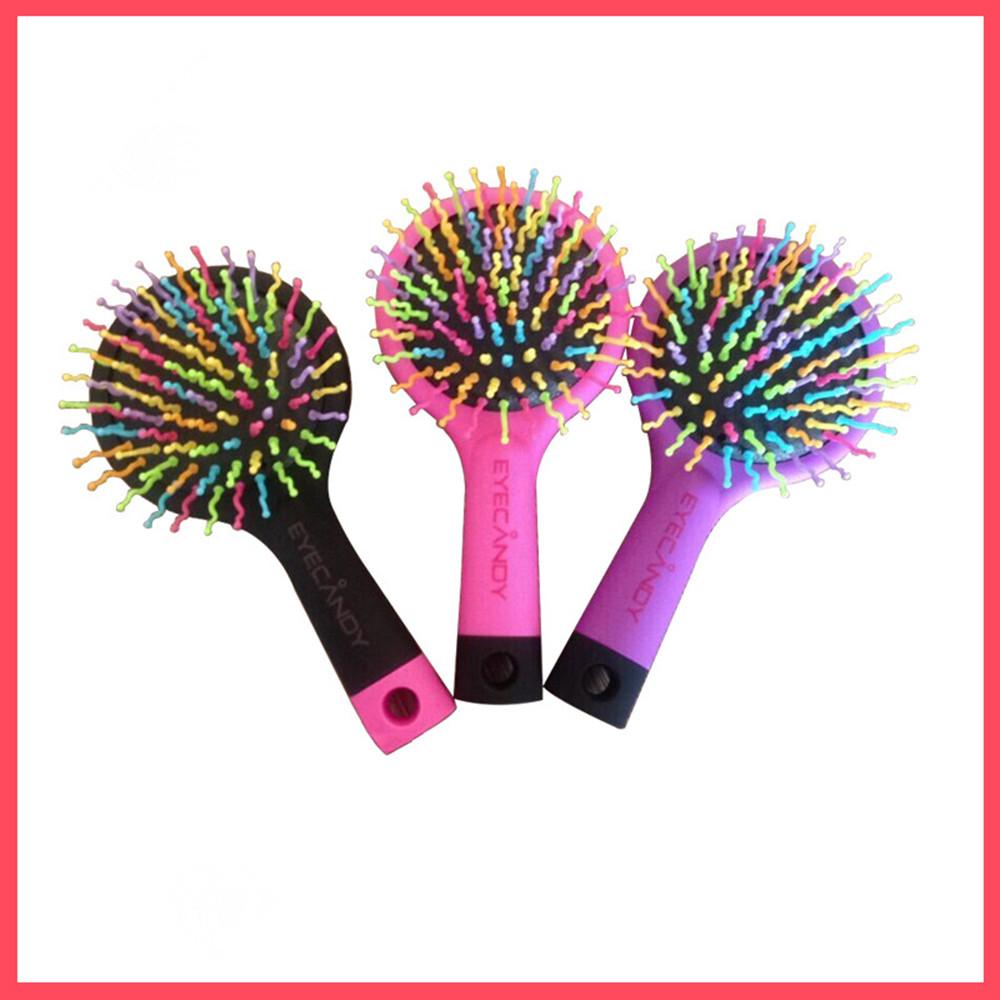 Three colorful rainbow-bristle brushes in different colorways