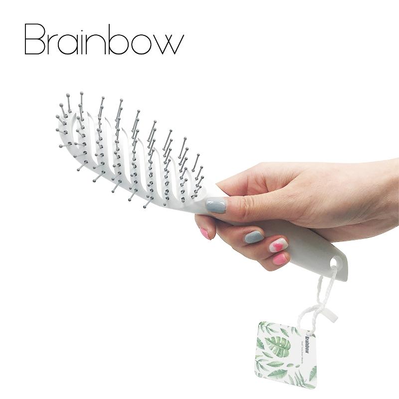 Ergonomic hair brush handle with hanging loop