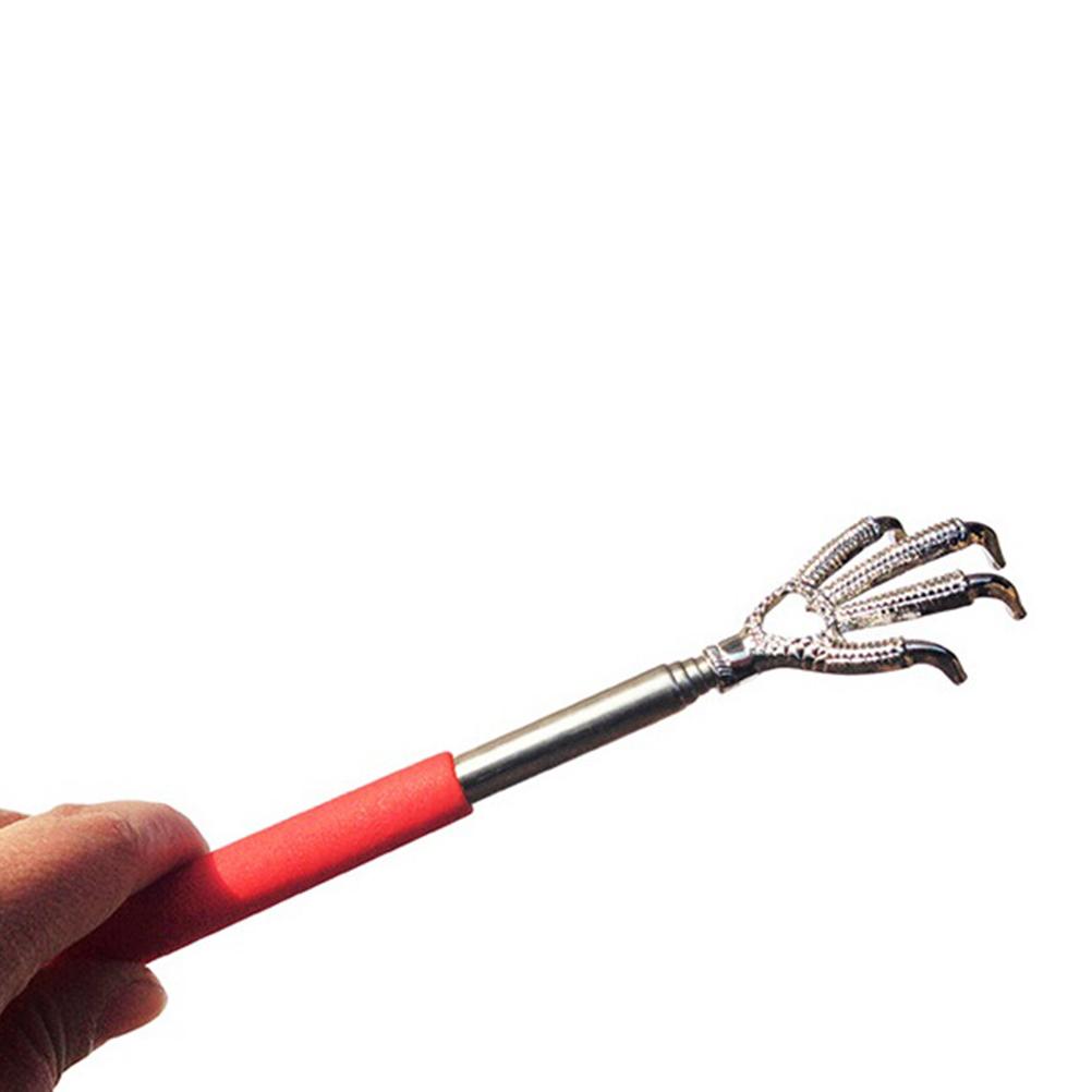 Hand holding red back scratcher in use, demonstrating grip and scale