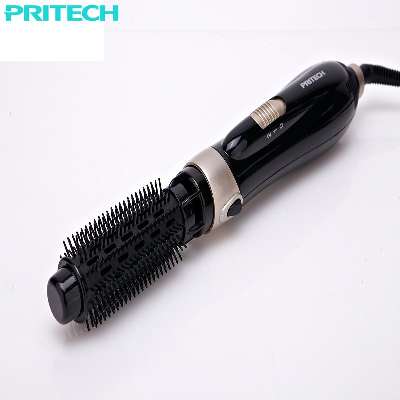Round brush attachment fitted to glossy black styling handle